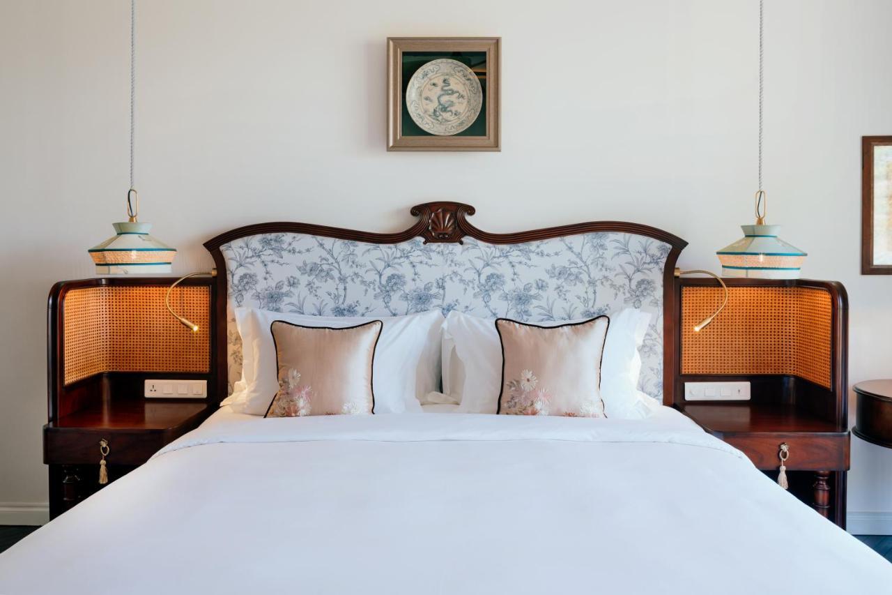 โรงแรมแปร์ล โดริย็อง กัตบา - เอ็มแกลเลอรี Chan Chau ภายนอก รูปภาพ A bedroom at the hotel